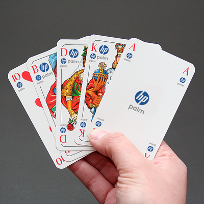 A picture of a royal flush, but the cards are branded with the HP Palm logo.