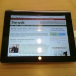 The iPad 2 with Deemable displayed on the screen.