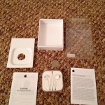 Apple EarPods and everything in the box spread out