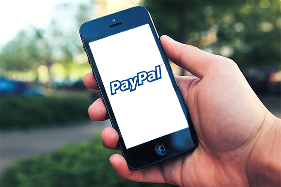PayPal, with its newly redesigned mobile app for iPhone and Android, hopes to start changing people's minds on mobile payments once again.